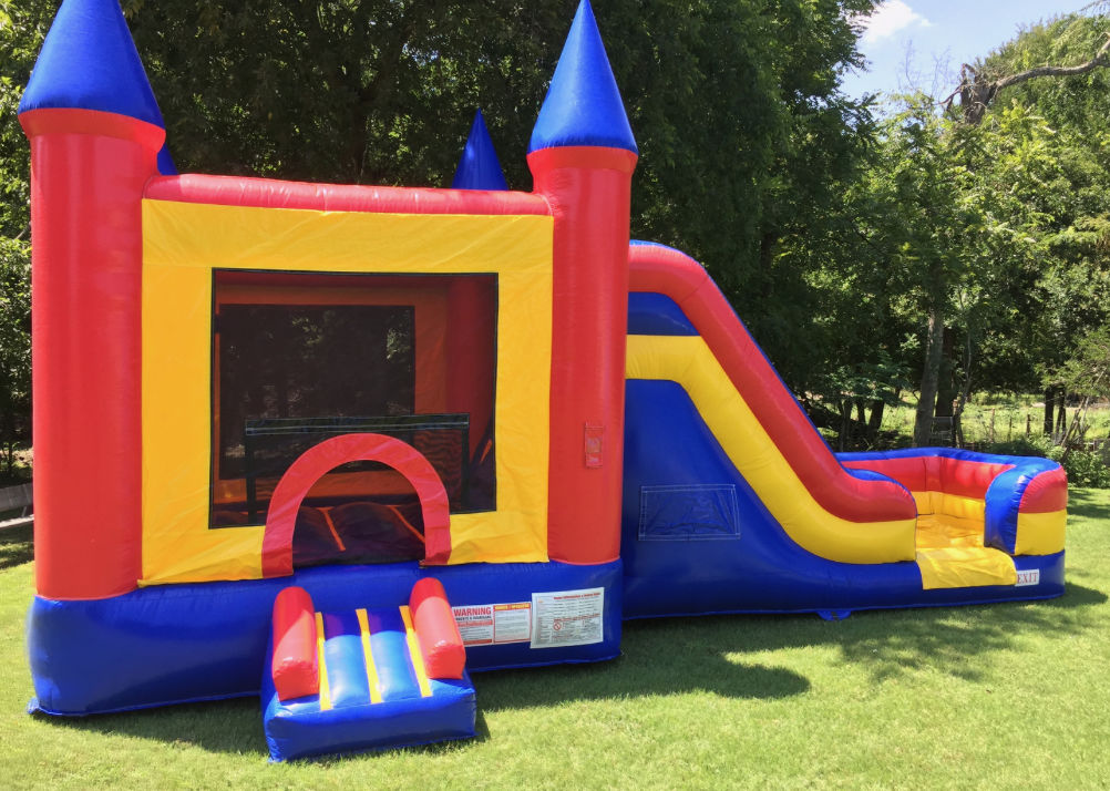 Colorful bouncy castle with slide