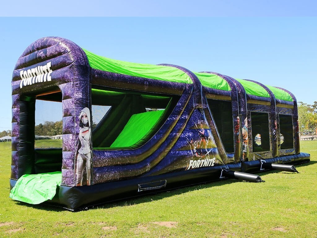 Fortnite-themed bouncy house obstacle course for game-themed birthday parties